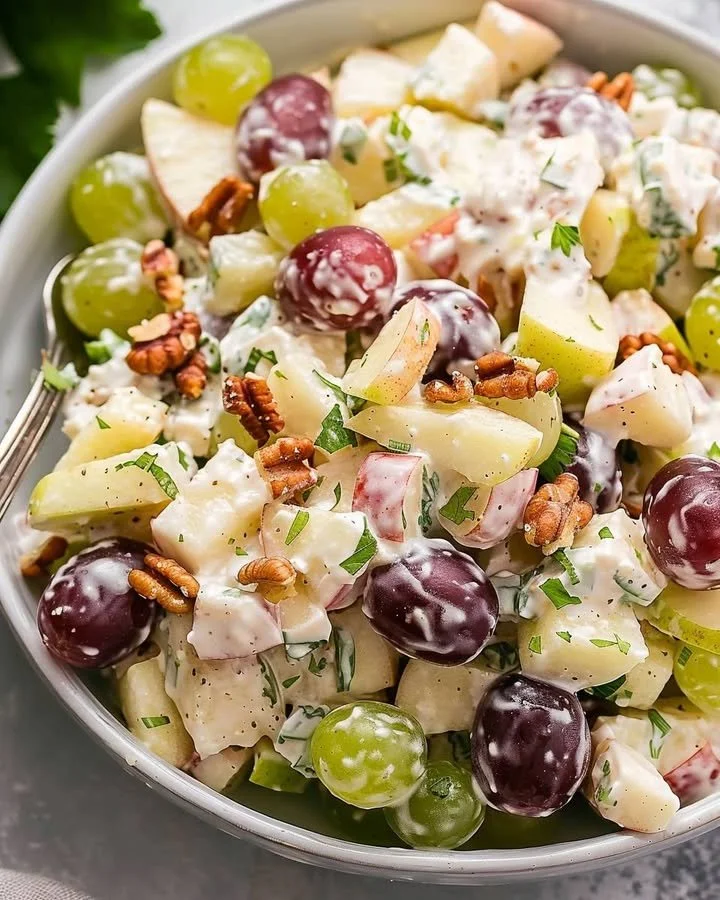 Waldorf Salad with apples, walnuts, and celery in a bowl