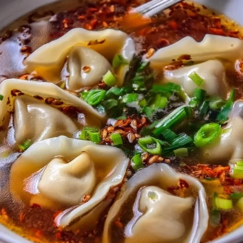 Delicious bowl of weeknight wonton soup with dumplings and fresh vegetables